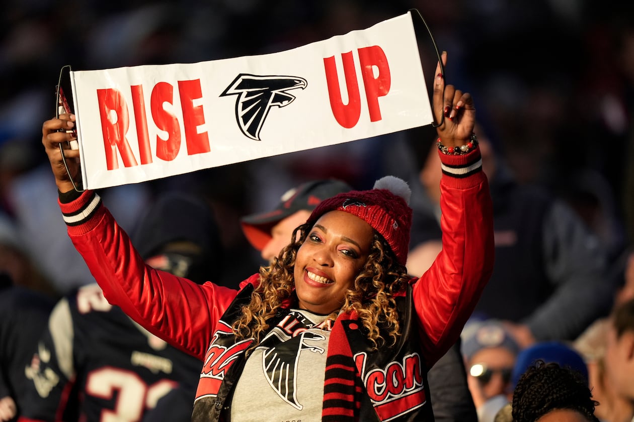 An Atlanta Falcons fan cheers during their game against the New England Patriots on Sunday, Nov. 2, 2025, in Foxborough, Mass. This week, the Falcons are in Berlin to take on the Indianapolis Colts. (Robert F. Bukaty/AP)