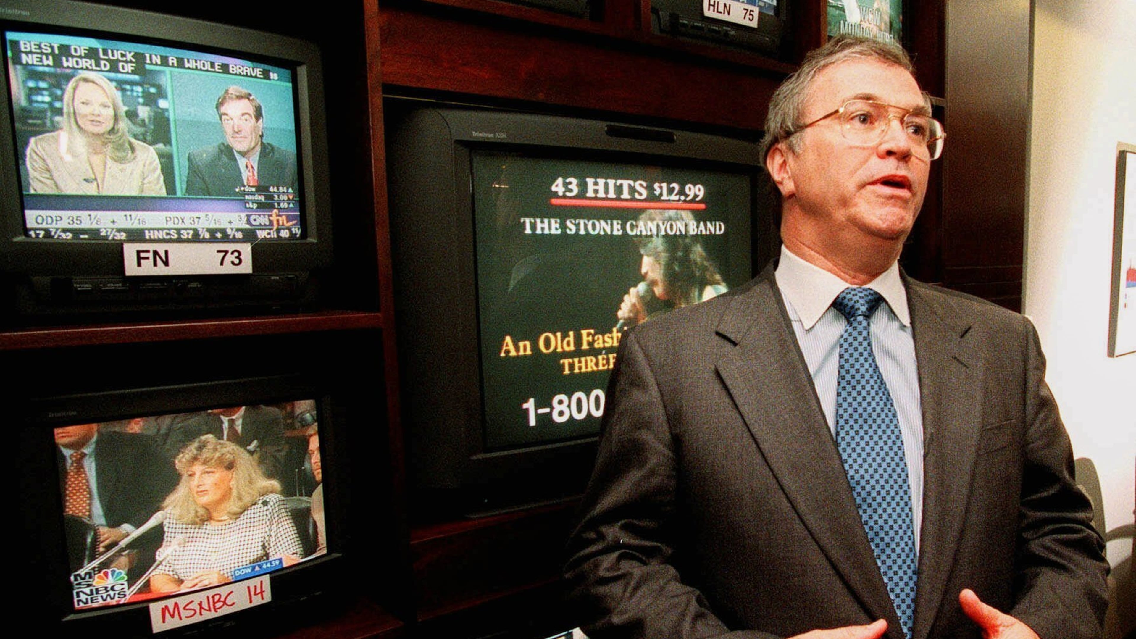 FILE - CNN CEO Tom Johnson talks about the network's retracted story about U.S. military use of nerve gas against Vietnam War defectors in his office at CNN's headquarters in Atlanta on July 6, 1998. Johnson said, "I regret that I let Ted (Turner) down. This is Ted's creation and I know he is disappointed." (AP Photo/Ric Feld, File)