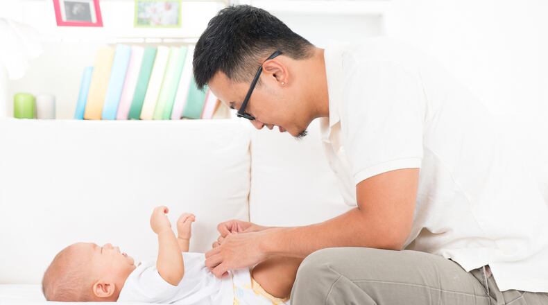 A new study found that modern dads tend to stay away from baby talk and speak to their children in patterns similar to those used when talking to adults. (Photo courtesy Fotolia/TNS)