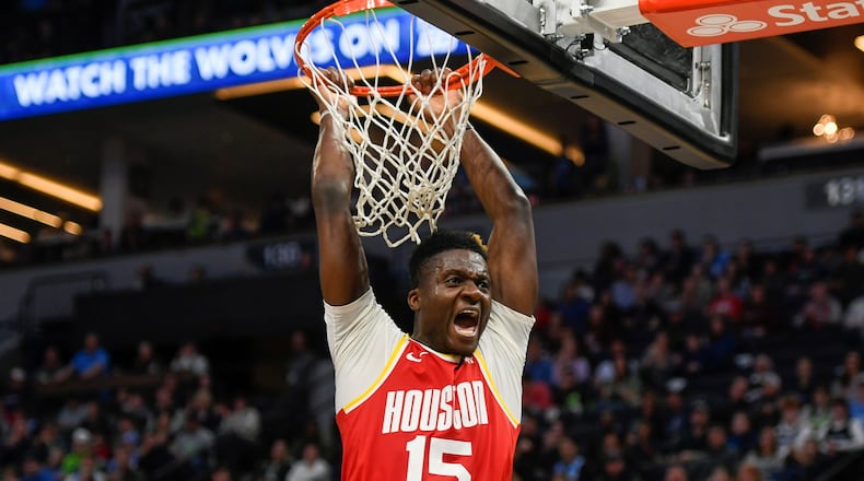 Houston Rockets center Clint Capela yells after dunking the ball against the Minnesota Timberwolves during the second half of an NBA basketball game Friday, Jan. 24, 2020, in Minneapolis. (AP Photo/Craig Lassig)