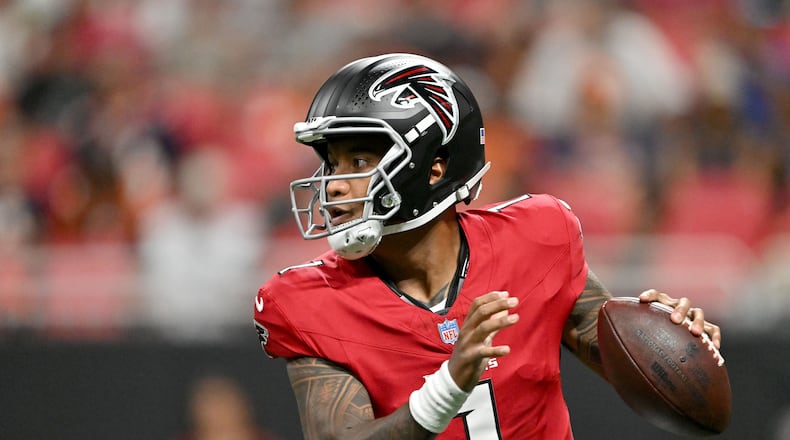 Falcons quarterback Tua Tagovailoa — pictured looking to pass against the Broncos in a preseason game Friday, Aug. 14, 2026 — was named Atlanta's starting quarterback after signing with the team in March. (Hyosub Shin/AJC)