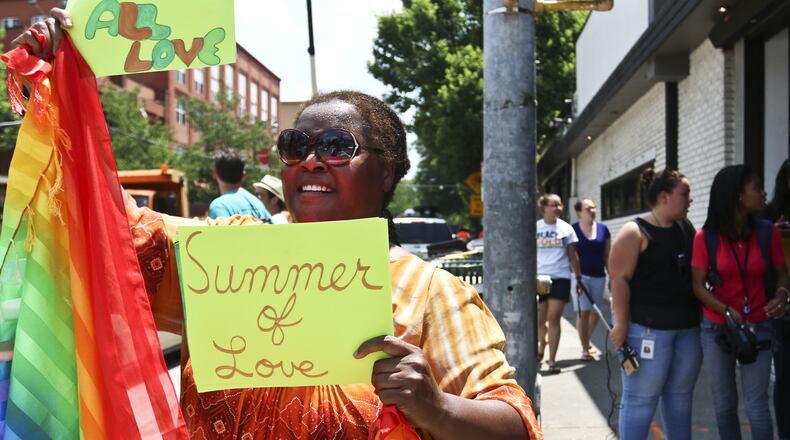A woman in Atlanta celebrates the Supreme Court’s decision legalizing gay marriage across the United States. (AP Photo/Ron Harris)