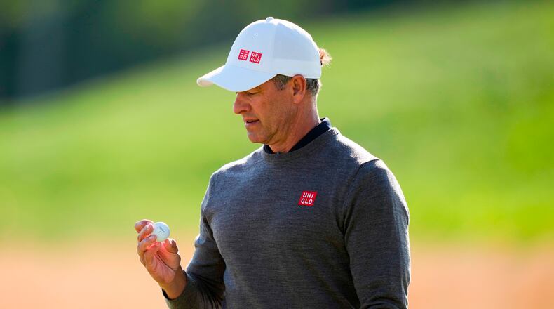 Adam Scott, of Australia, looks at his ball on the 10th green during the second round of the PGA Championship golf tournament at Aronimink Golf Club, Friday, May 15, 2026, in Newtown Square, PA. (AP Photo/Matt Slocum)