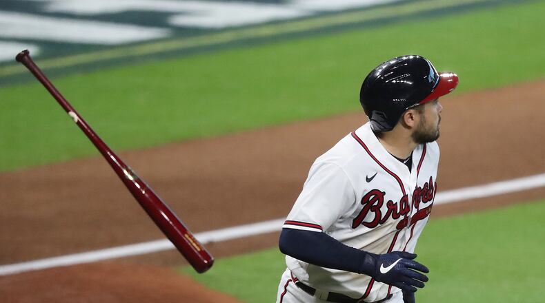 100720 Houston: Atlanta Braves Travis d’Arnaud flips his bat hitting a solo homer for a 2-0 lead against the Miami Marlins during the 4th inning in Game 2 of a National League Division Series at Minute Maid Park on Wednesday, Oct 7, 2020 in Houston.   “Curtis Compton / Curtis.Compton@ajc.com”