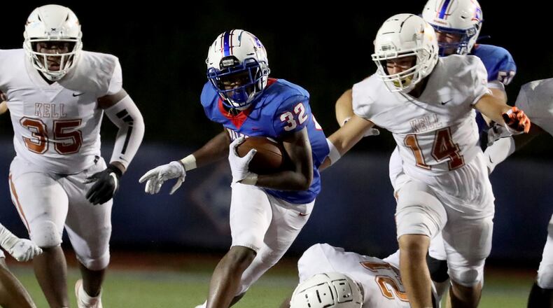 Walton running back Braylen Stokes (32) runs for yards in the second half against Kell during their 35-28 win at Walton high school Friday, September 4, 2020 in Marietta, Ga.. This is one of several football games during the 2020 Corky Kell Classic.(Jason Getz/Special to the AJC)