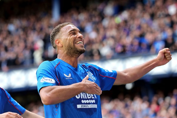 Rangers' Cyriel Dessers celebrates scoring their side's first goal of the game during the Scottish Premiership soccer match between Rangers and Celtic at Ibrox Stadium, Glasgow, Scotland, Sunday, May 4, 2025. (Steve Welsh/PA via AP)