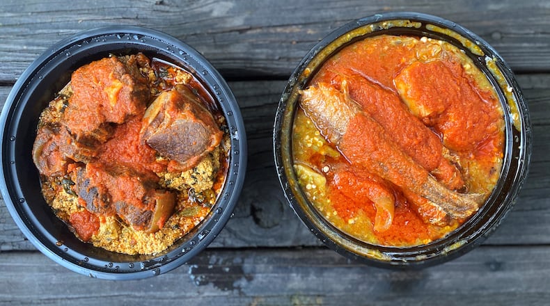 Toyin takeout: egusi (melon-seed stew) with beef and goat and okra stew with whiting and cow’s leg.
Wendell Brock for The Atlanta Journal-Constitution