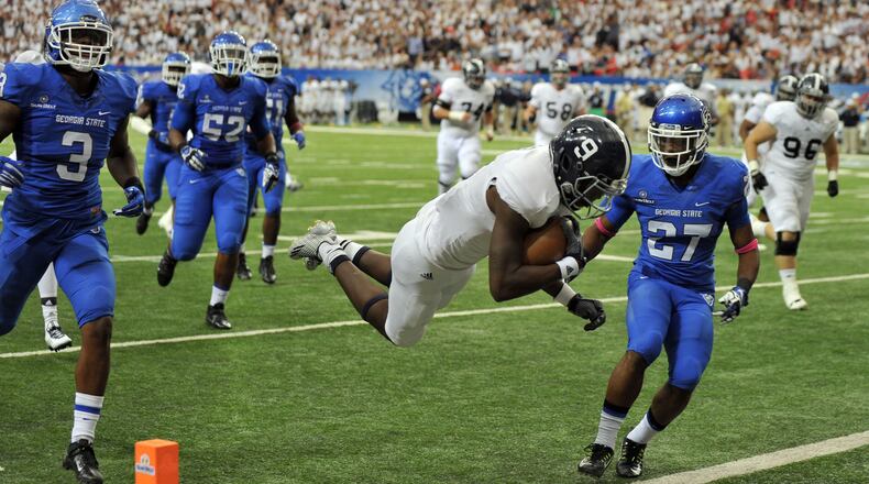 Georgia Southern Eagles wide receiver Zach Walker dives into the end zone for a second quarter touchdown against Georgia State at the Georgia Dome Saturday October 25, 2014. BRANT SANDERLIN / BSANDERLIN@AJC.COM