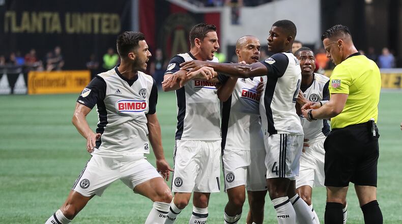June 2, 2018 Atlanta: Philadelphia Union players Haris Medunjanin (from left) and Alejandro Bedoya are held back by teammates as they both draw red cards and are ejected from the game against the Atlanta United during the first half in a MLS soccer match on Saturday, June 2, 2018, in Atlanta.  Curtis Compton/ccompton@ajc.com