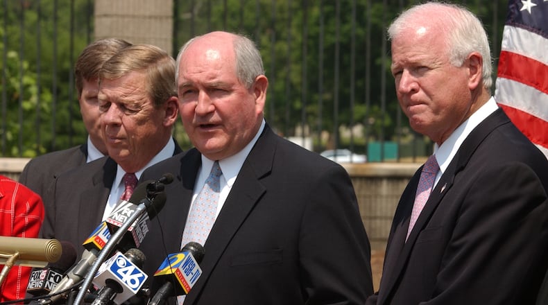 Senator Johnny Isakson, left, then-Gov. Sonny Perdue, center, and then-Sen. Saxby Chambliss in 2005. (W.A. BRIDGES JR./AJC staff)