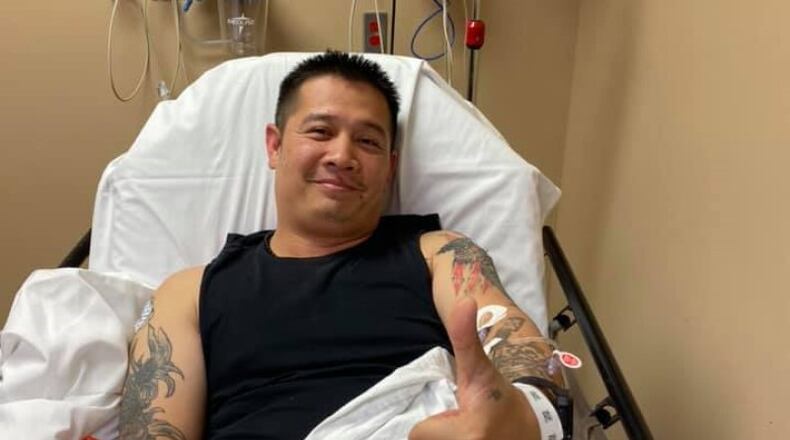 Morrow police Sgt. Quatch gives a thumbs up from his hospital bed at Southern Regional Medical Center. Quatch fell Thursday evening while chasing shoplifting suspects and suffered a compound fracture to his right arm.