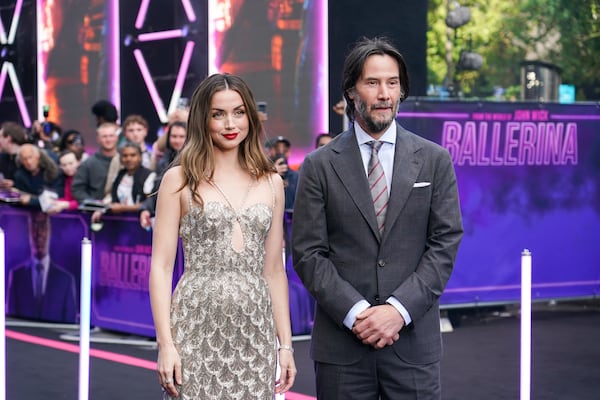 Ana De Armas, left, and Keanu Reeves pose for photographers upon arrival at World premiere of the film 'Ballerina' in London, Thursday, May 22, 2025. (Photo by Alberto Pezzali/Invision/AP)