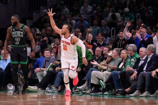 New York Knicks guard Jalen Brunson (11) celebrates after hitting a 3-pointer during the first half of Game 5 of an NBA basketball second-round playoff series against the Boston Celtics, Wednesday, May 14, 2025, in Boston. (AP Photo/Charles Krupa)
