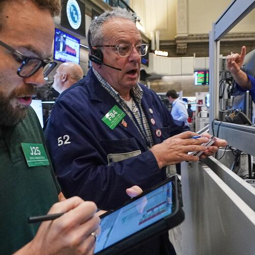Options traders Serge Marinovich, left, and Phil Phil Fracassini work on the floor of the New York Stock Exchange, Friday, June 26, 2026. (AP Photo/Richard Drew)