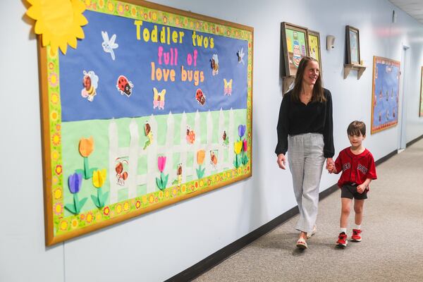 Rebecca Ellis walks her son, John Patrick, back to class at The Capitol Hill Child Enrichment Center in Atlanta on Wednesday, April 22, 2026. (Abbey Cutrer/AJC)