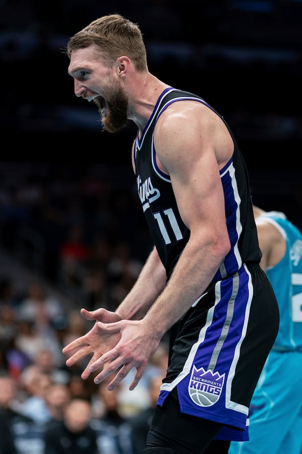 Sacramento Kings forward Domantas Sabonis reacts during the second half of an NBA basketball game against the Charlotte Hornets, Friday, April 4, 2025, in Charlotte, N.C. (AP Photo/Jacob Kupferman)
