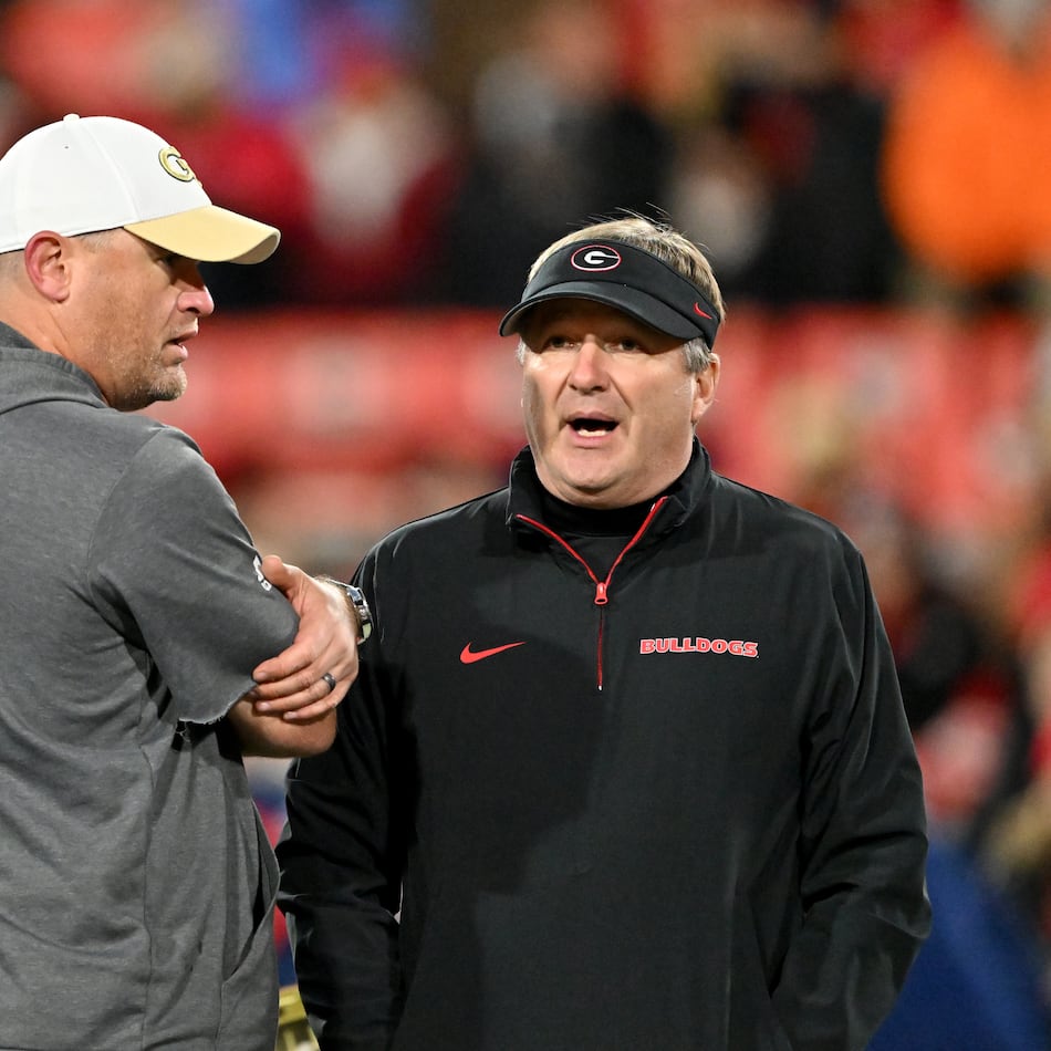 Georgia Tech's Brent Key (left) and Georgia's Kirby Smart — pictured chatting before the 2024 matchup between the teams — both still have a shot at making their conference title games. The Bulldogs need Texas A&M to lose to Texas or Alabama to lose to Auburn, and the Yellow Jackets need losses by Southern Methodist, Pitt and Virginia. (Hyosub Shin/AJC 2024)
