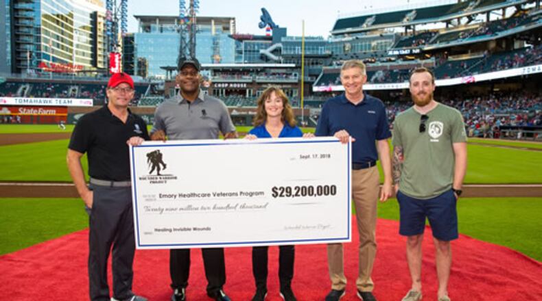 (From left to right) Wounded Warrior Project’s Michael Richardson and Alonzo Smith pictured with Emory Healthcare Veterans Program representatives, retired Lt. Gen. William “Burke” Garrett, Sheila Rauch and Marine veteran Timothy Banik during the Sept. 17 pregame presentation at the Atlanta Braves’ SunTrust Park.