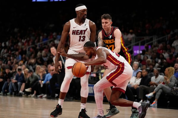 Miami Heat forward Haywood Highsmith (24) dribbles the ball in the first half of an NBA play-in tournament basketball game against the Atlanta Hawks Friday, April 18, 2025, in Atlanta. (AP Photo/Brynn Anderson)