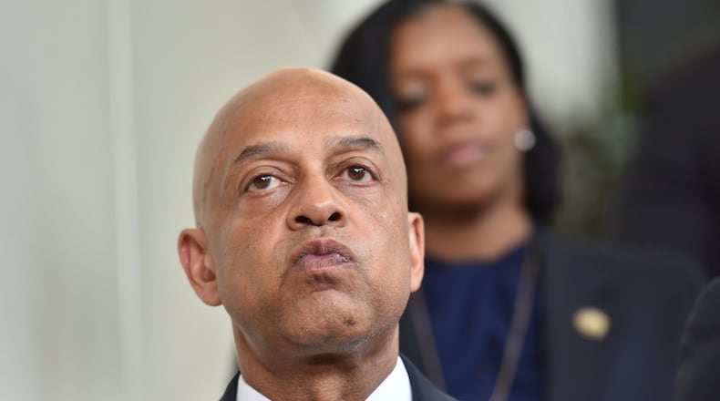 DeKalb County Sheriff Jeffrey Mann reacts as his attorney Noah Pines speaks during a press conference at the DeKalb County Sheriff’s Office on May 12. DeKalb County Sheriff Jeffrey Mann, speaking through his lawyer, apologized to his constituents and said he plans to continue serve in his job. HYOSUB SHIN / HSHIN@AJC.COM