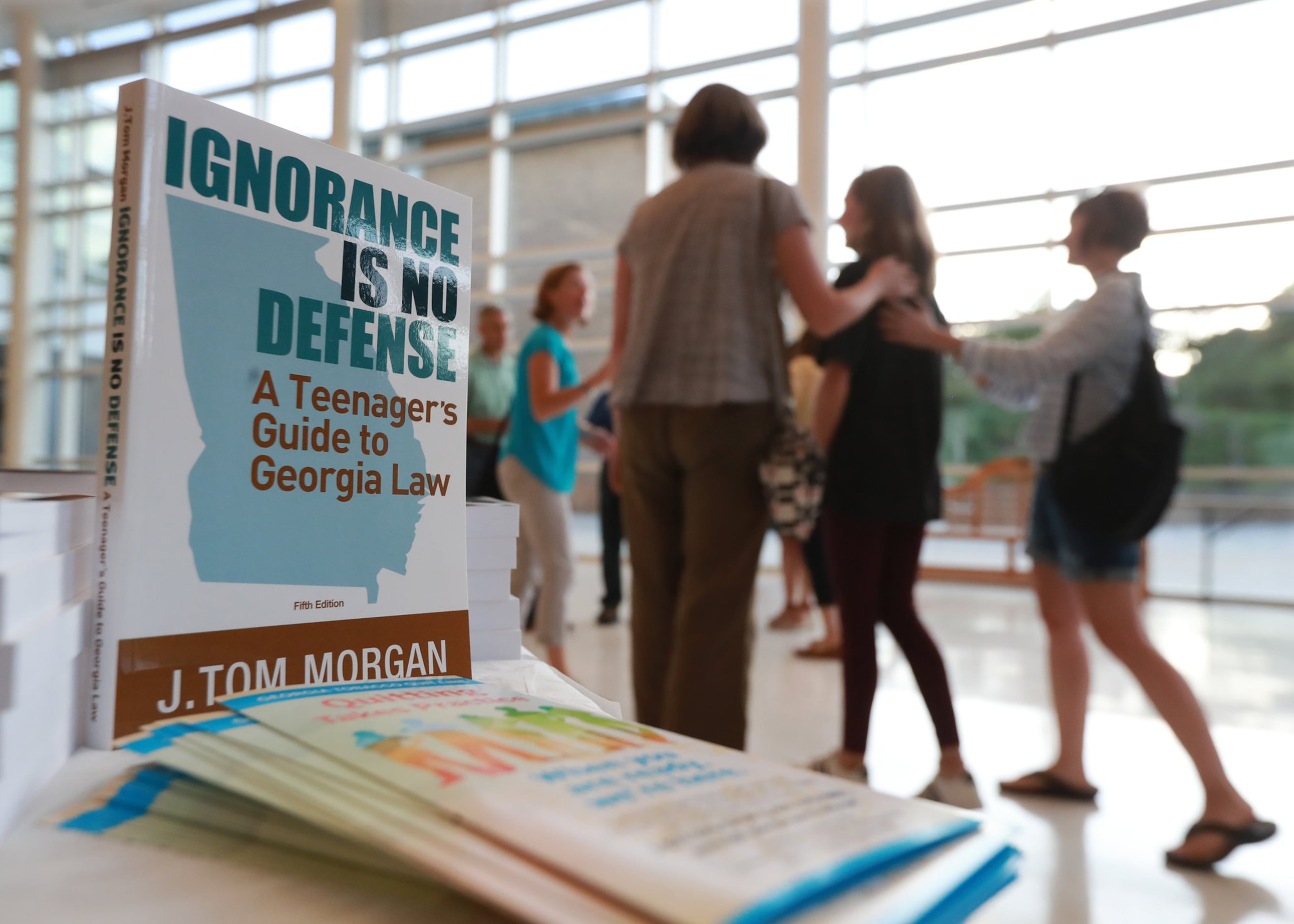 Students and parents arrive for a educational presentation about vaping at Lakeside High School in Atlanta. Retail stores that sell vape products within the city are no longer allowed to operate near elementary and middle schools. (AJC 2019)