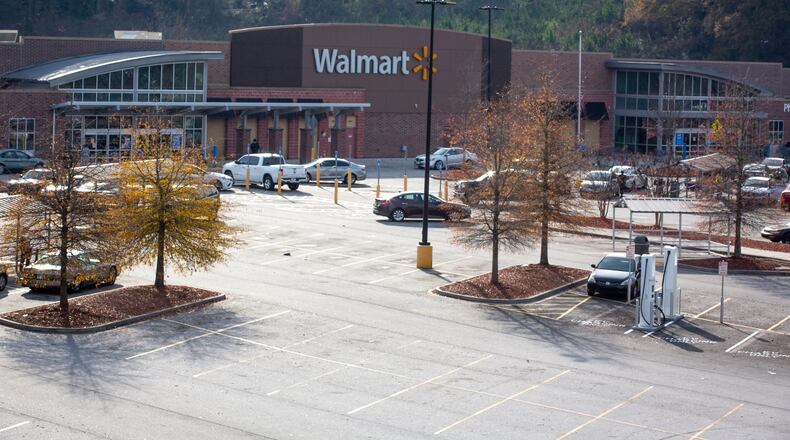 The parking lot of the East Point Walmart was mostly empty Friday afternoon after the store's loss prevention officer was shot while confronting a shoplifting suspect, authorities said.