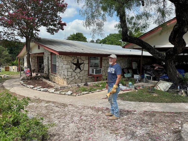 Daniel Olivas stands outside his flood-damaged home in Kerrville, Texas, Saturday, July 12, 2025. (AP Photo/Gabriela Aoun Angueira)
