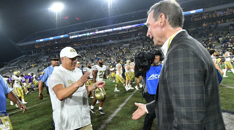 September 9, 2022 Atlanta - Georgia Tech's head coach Geoff Collins is greeted by Director of Athletics Todd Stansbury after Georgia Tech beat Western Carolina in an NCAA college football game at Georgia Tech's Bobby Dodd Stadium in Atlanta on Saturday, September 10, 2022. Georgia Tech won 35-17 over Western Carolina. (Hyosub Shin / Hyosub.Shin@ajc.com)