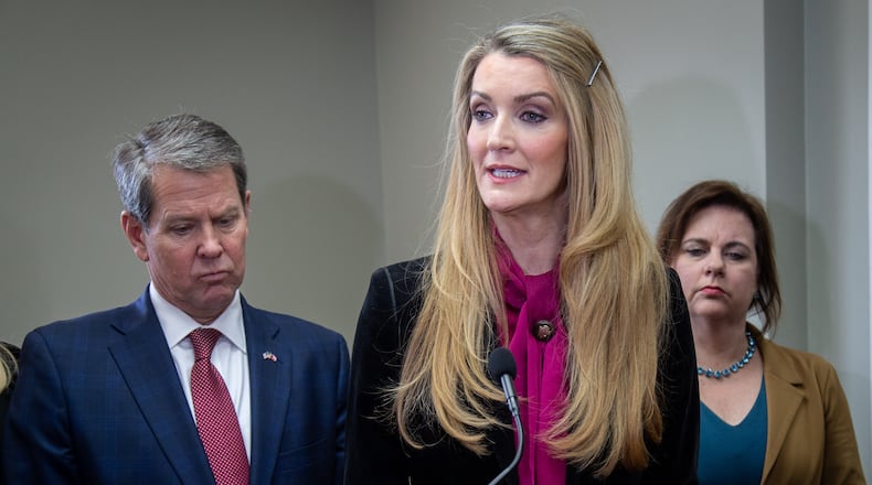 U.S. Senator Kelly Loeffler flanked by Gov. Brian Kemp (L) and Susan B. Anthony List President Marjorie Dannenfelser (R) speaks during a press conference at the First Care Womenâs Clinic in Marietta Friday, February 14, 2020.  (Steve Schaefer for The Atlanta Journal-Constitution)