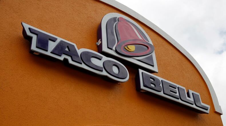FILE - This Friday, May 23, 2014, file photo shows a sign at a Taco Bell in Mount Lebanon, Pa. The chain's "Love and Tacos" contest offers couples the chance to win an all-expense paid trip to Las Vegas to get married in a chapel at the chain's flagship restaurant. The winner will be announced March 16, 2017. (AP Photo/Gene J. Puskar, File)