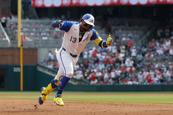 Atlanta Braves' Ronald Acuña Jr. celebrates as he rounds the bases after hitting a home run during the fourth inning of a baseball game against the Boston Red Sox, Saturday, May 31, 2025, in Atlanta. (AP Photo/Butch Dill)