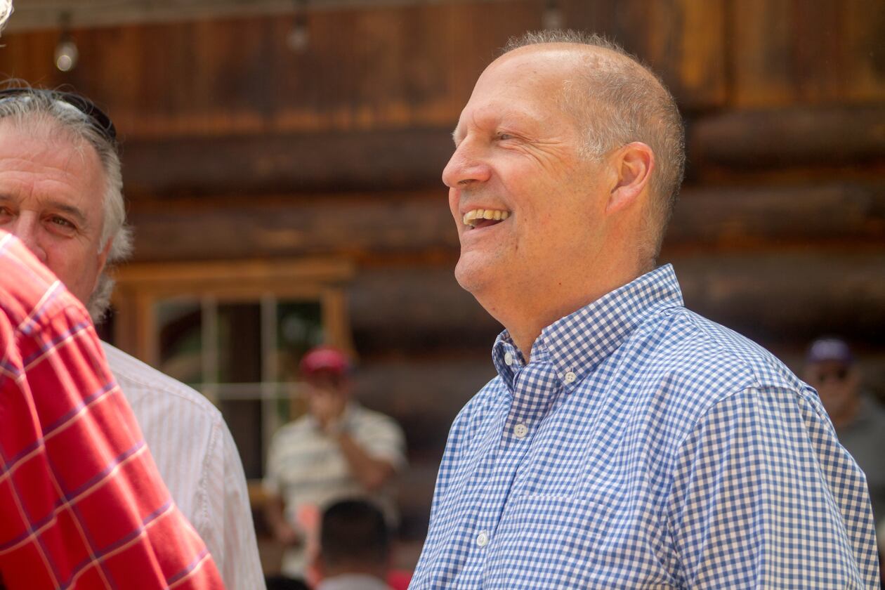 Former Sen. John E. Sununu, who is running for his old seat nearly 18 years after being ousted, mingles with voters at the Coos County Republican Committee BBQ in Berlin, N.H., Saturday, Aug. 22, 2026. (AP Photo/Holly Ramer)