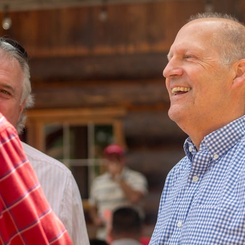 Former Sen. John E. Sununu, who is running for his old seat nearly 18 years after being ousted, mingles with voters at the Coos County Republican Committee BBQ in Berlin, N.H., Saturday, Aug. 22, 2026. (AP Photo/Holly Ramer)