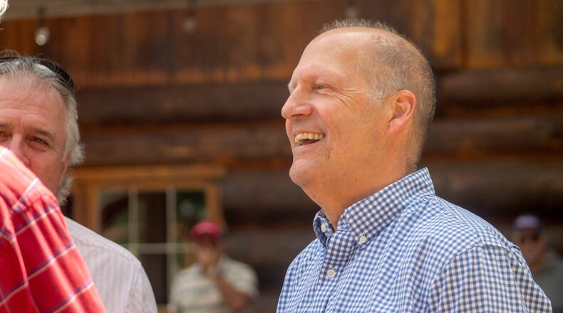 Former Sen. John E. Sununu, who is running for his old seat nearly 18 years after being ousted, mingles with voters at the Coos County Republican Committee BBQ in Berlin, N.H., Saturday, Aug. 22, 2026. (AP Photo/Holly Ramer)