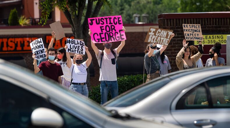 A June protest organized by students in Johns Creek over the recent Minniapolis police killing of George Floyd, is held at the intersection of Medlock Bridge Road and State Bridge Road. Since then, many in the Johns Creek community have been upset over negative comments made by the police chief on the Black Lives Matter movement. City officials held a community forum on police and race on July 9. JOHN AMIS FOR THE ATLANTA JOURNAL-CONSTITUTION