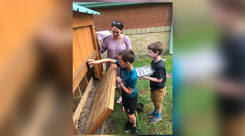 Students and teachers work recently on agriculture education projects. PHOTO COURTESY GEORGIA AGRICULTURAL EDUCATION