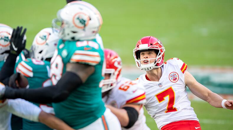 Kansas City Chiefs kicker Harrison Butker (7) watches the ball as he kicks an extra point against the Miami Dolphins Sunday, Dec. 13, 2020, in Miami Gardens, Fla. (Doug Murray/AP)