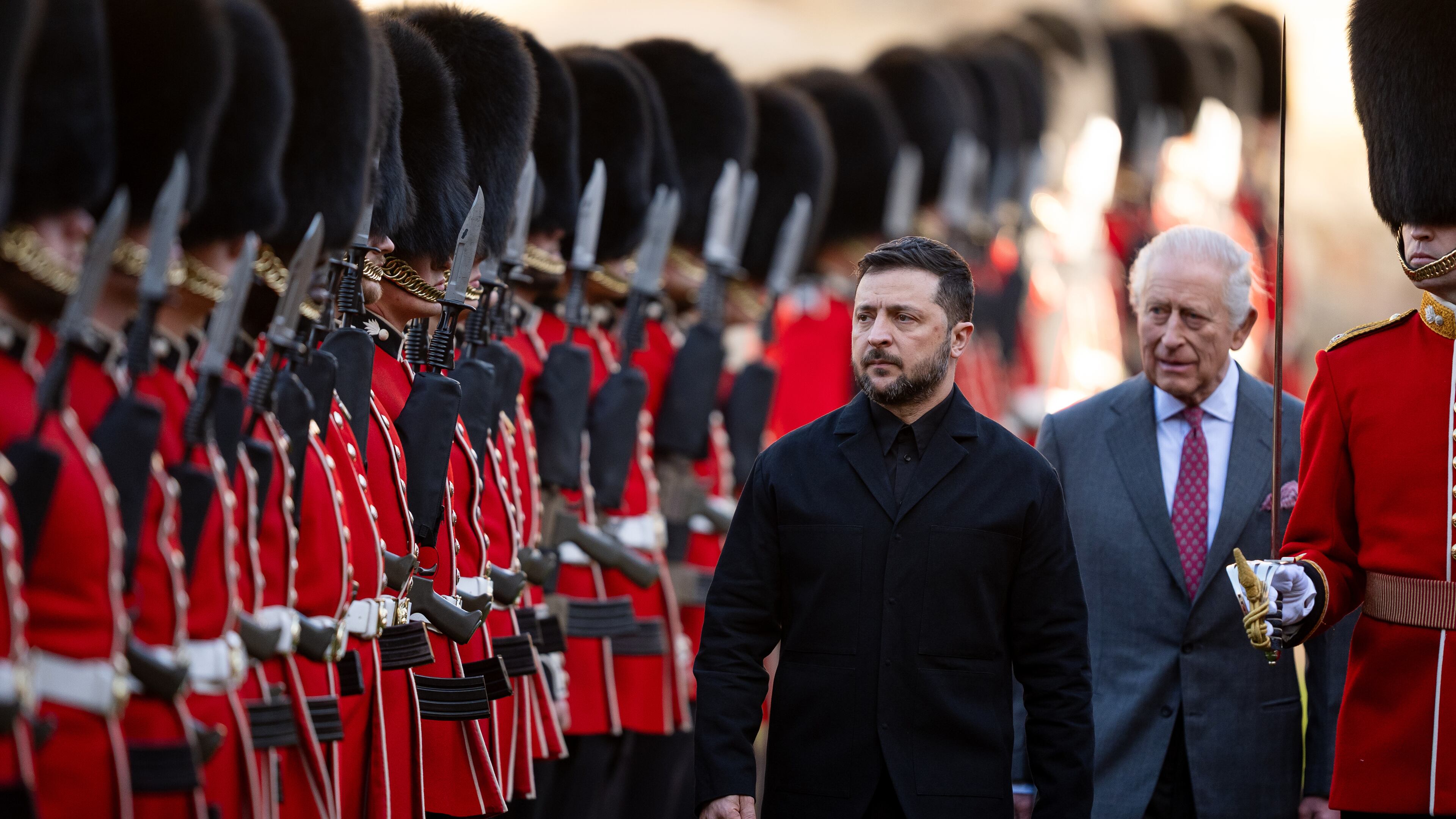 Centre from left: Ukraine's President Volodymyr Zelenskyy, King Charles III and Major Ben Tracey inspecting a guard of honour at Windsor Castle, England, Friday, Oct, 24, 2025. (Aaron Chown/Pool Photo via AP)