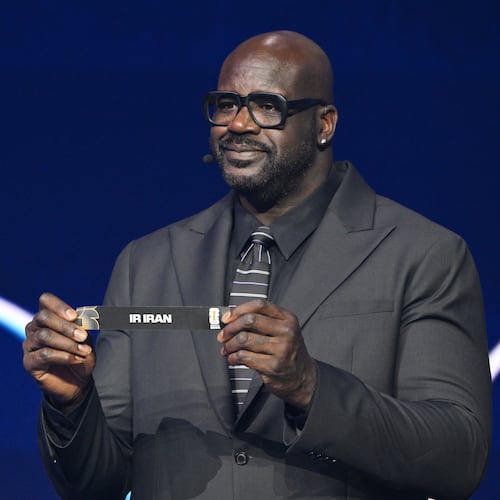 Former NBA player Shaquille O'Neal holds up Iran after drawing from a pot during the draw for the 2026 soccer World Cup at the Kennedy Center in Washington, Friday, Dec. 5, 2025. (Mandel Ngan/Pool Photo via AP)