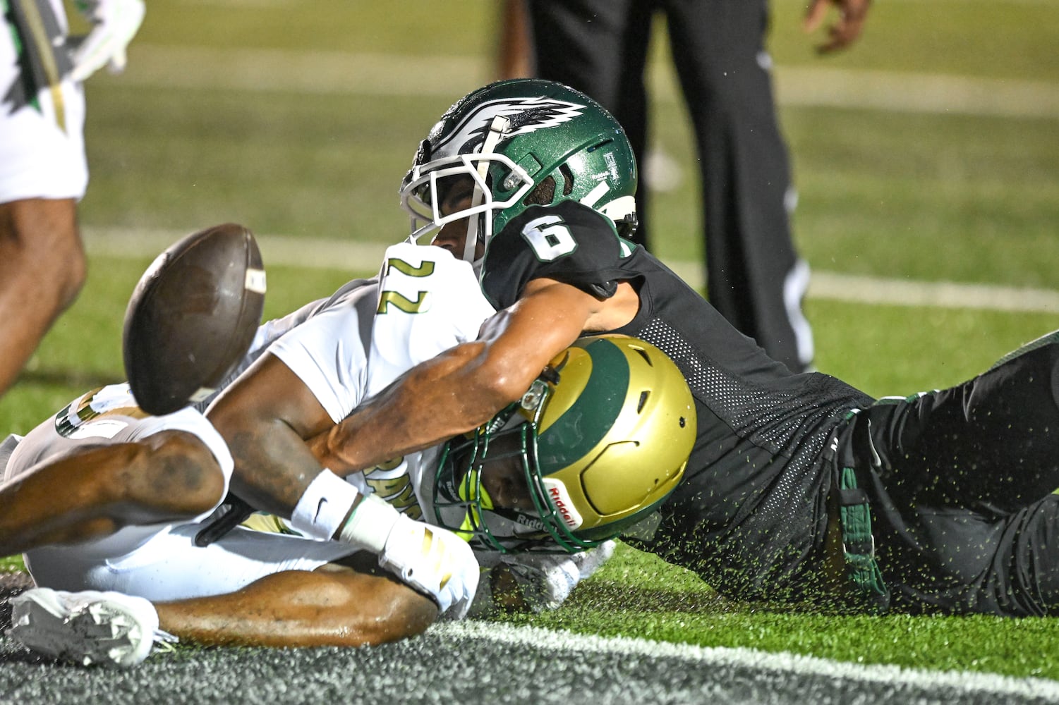 Collins Hill wide receiver Atticus Joseph loses control of the ball after being hit by Grayson defensive back Damari Clemons during the first half of play Friday, August 15, 2025. (Daniel Varnado for the AJC)