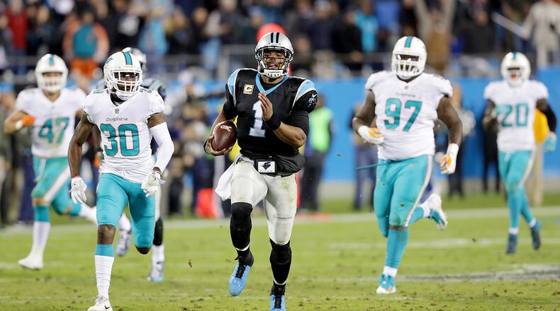 CHARLOTTE, NC - NOVEMBER 13: Cam Newton #1 of the Carolina Panthers runs with the ball against the Miami Dolphins during their game at Bank of America Stadium on November 13, 2017 in Charlotte, North Carolina. (Photo by Streeter Lecka/Getty Images)