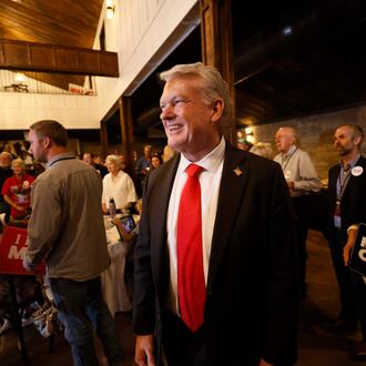 U.S. Rep. Mike Collins prepares to give a speech during his runoff election watch party at Seven Oaks Manor in Jackson last Tuesday. (Miguel Martinez/AJC)