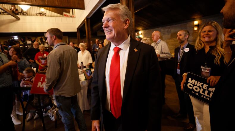 U.S. Rep. Mike Collins prepares to give a speech during his runoff election watch party at Seven Oaks Manor in Jackson last Tuesday. (Miguel Martinez/AJC)