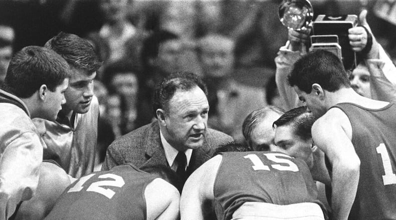 Actor Gene Hackman gives instructions to his players during the movie "Hoosiers".