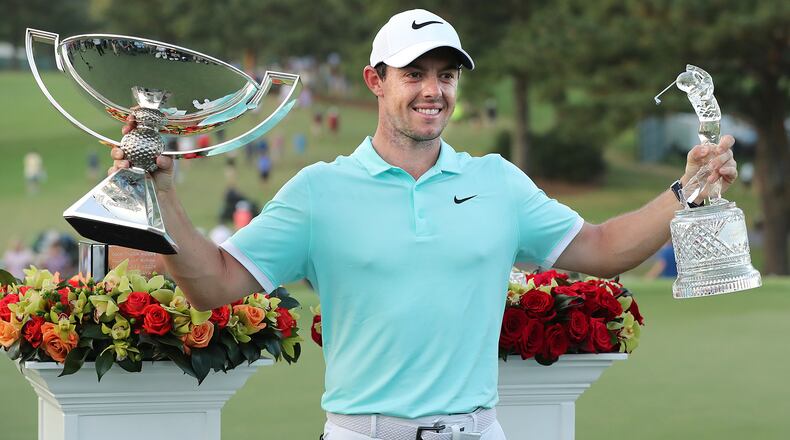 Rory McIIroy with his hardware after winning the Tour Championship and the FedEx Cup by sinking a birdie putt on the fourth playoff hole during the final round of the Tour Championship at East Lake Golf Club on Sunday, Sept. 25, 2016, in Atlanta. McIlroy beat Ryan Moore and Kevin Chappell in a three way playoff. Curtis Compton /ccompton@ajc.com