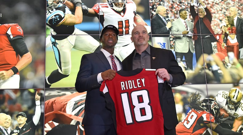 April 27, 2018 Flowery Branch - Falcons first round pick Calvin Ridley poses with Head Coach Dan Quinn during a press conference at the Falcons training facility on Friday, April 27, 2018. The former Alabama wide receiver, selected by the Falcons with the 26th pick of the first round of the NFL draft Thursday night. HYOSUB SHIN / HSHIN@AJC.COM