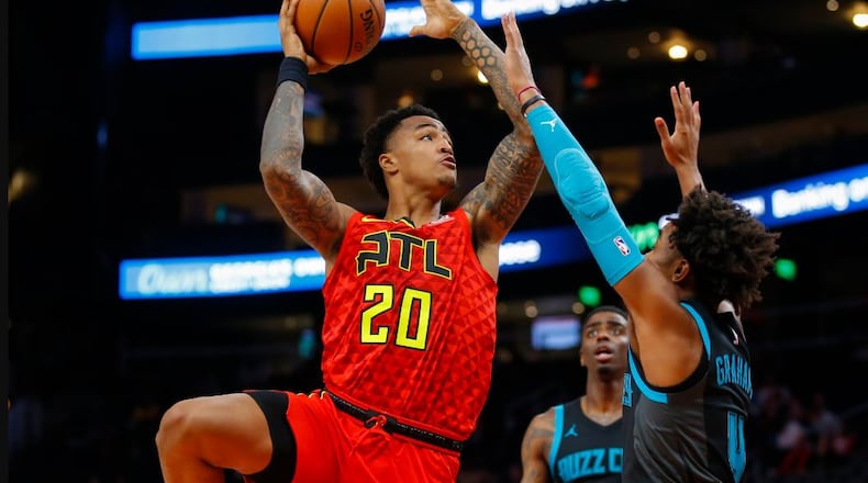 John Collins goes up for a shot during Sunday's game. (AP photo)