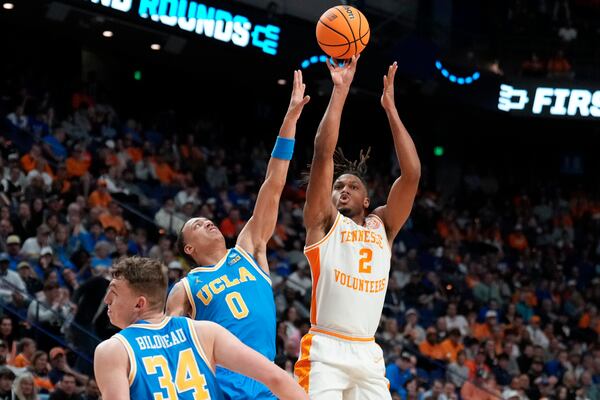 Tennessee guard Chaz Lanier (2) shoots against UCLA guard Kobe Johnson (0) during the second half in the second round of the NCAA college basketball tournament, Saturday, March 22, 2025, in Lexington, Ky. (AP Photo/Brynn Anderson)