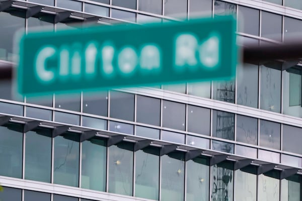 The notable bullet marks on the windows of the Centers for Disease Control and Prevention headquarters are visible from Clifton Rd, on Sunday August 10, 2025. Fallen DeKalb County police officer David Rose, 33, died in the line of duty while responding to a shooter who fired at the CDC on Friday.
(Miguel Martinez/AJC)