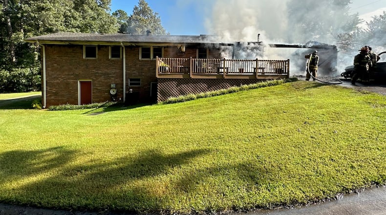 Firefighters rescued a man who was trapped inside a burning Douglas County home Tuesday morning.